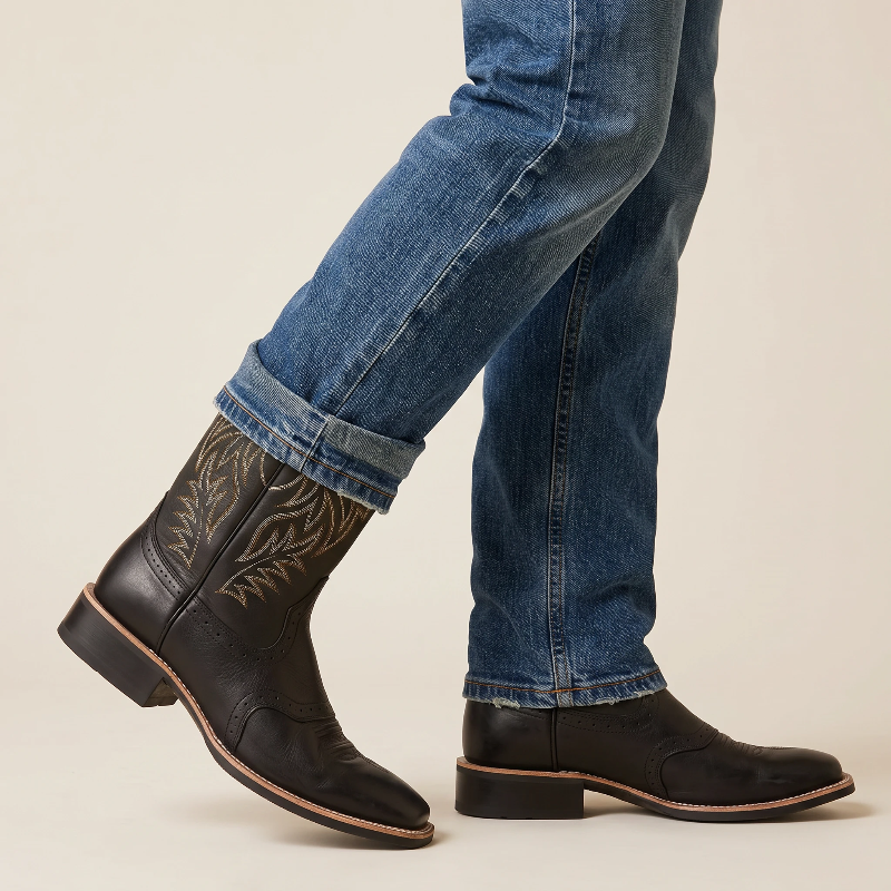 Yehaw black vegan leather cowboy boots with square toe and rubber sole, showing the bottom view