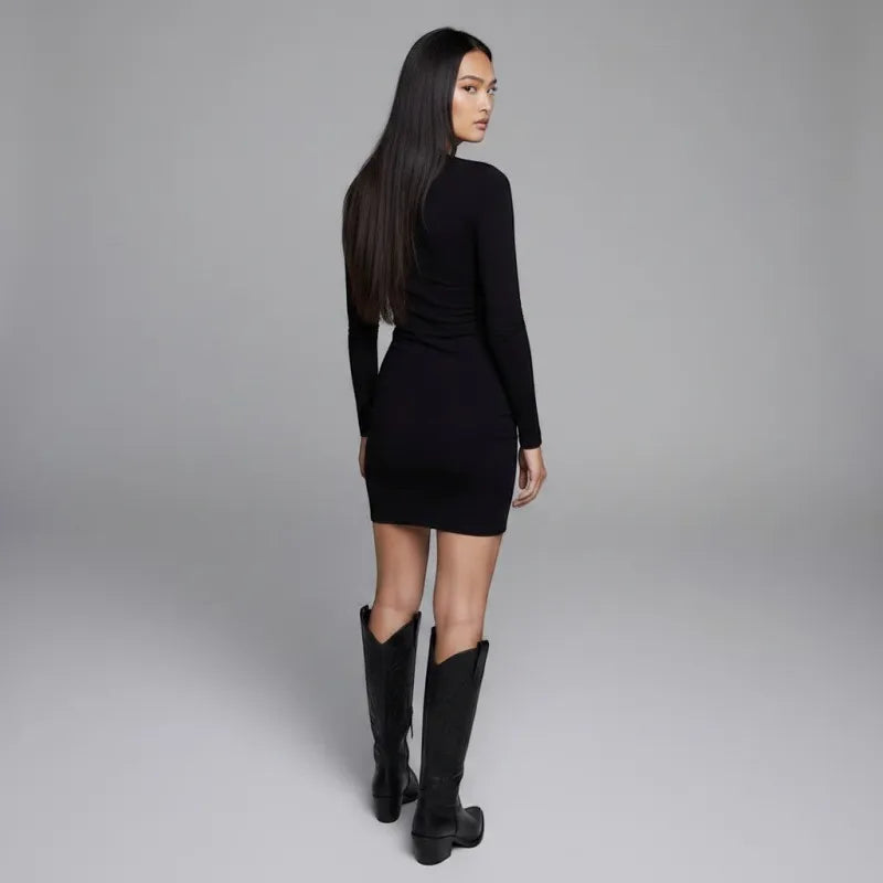 Yehaw black vegan leather knee-high cowboy boots with pointed toe and medium heel, featuring zip fastening.