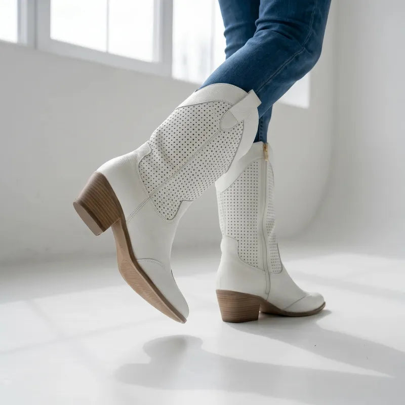 Yehaw white vegan leather cowgirl boots with perforated details and a medium block heel.
