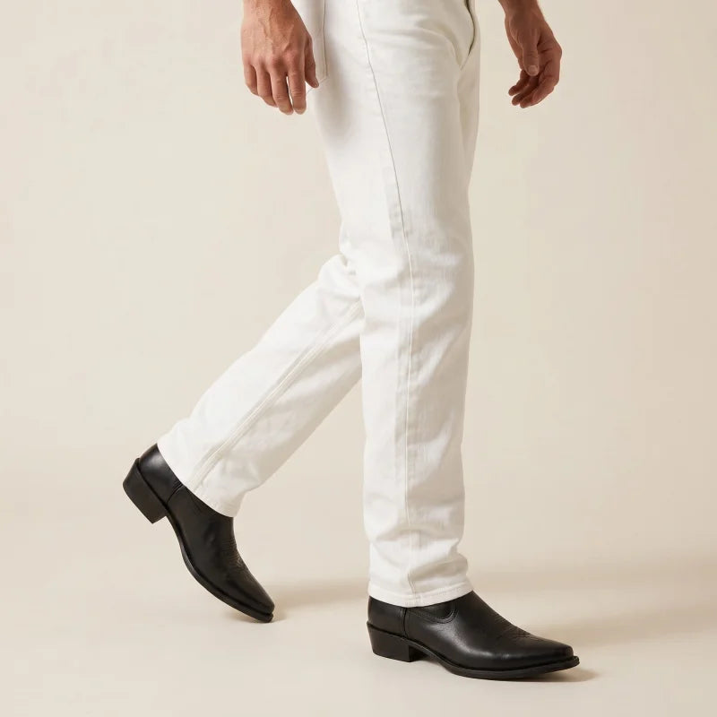 Yehaw black vegan leather cowboy boots with a pointed toe and low heel worn with white jeans
