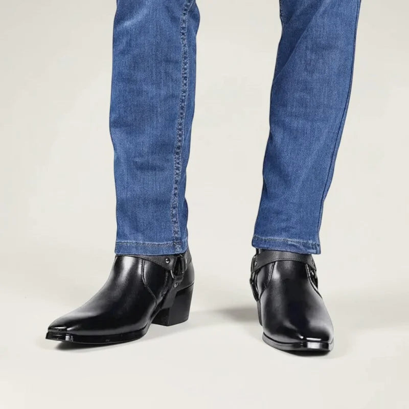 Yehaw black vegan leather ankle cowboy boots with pointed toes and side zip, worn with blue jeans.
