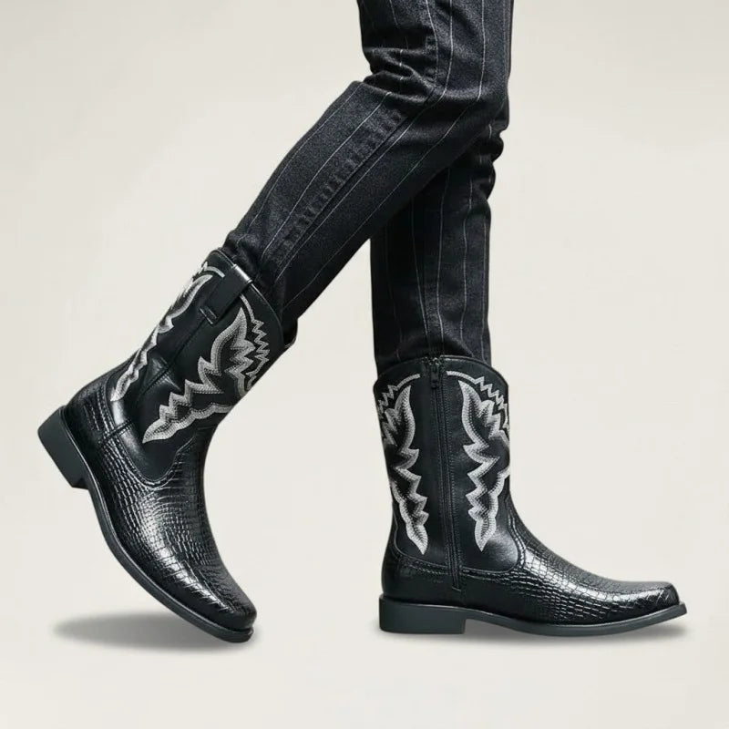 Yehaw black vegan leather cowboy boots with white western stitching, mid-calf height, and side zip on a model.