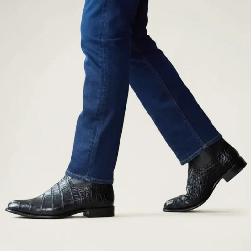 Yehaw black vegan leather cowboy boots with a textured finish worn by a man in blue jeans