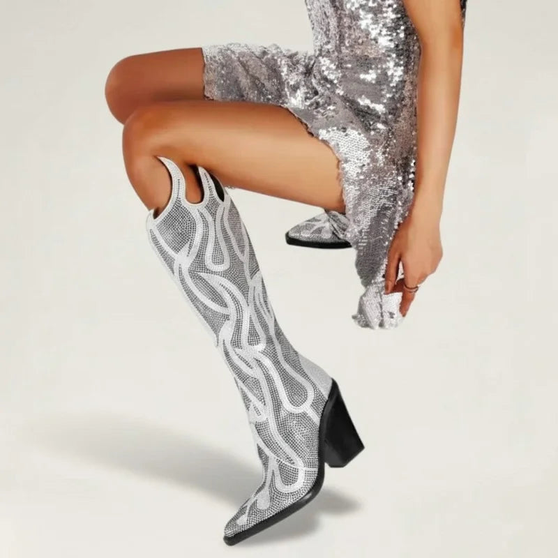 Yehaw silver knee-high vegan microfibre cowgirl boots with square toe, high heel, and flame-inspired detailing.