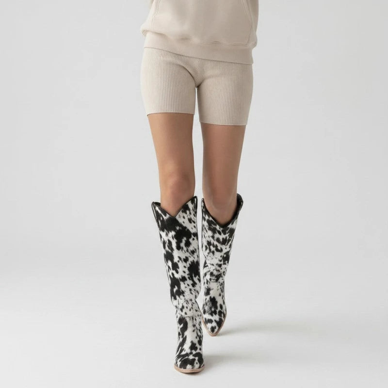 Yehaw MILK knee-high cowgirl boots in black and white vegan suede with a pointed toe and medium heel.
