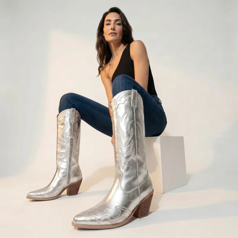Model wearing Yehaw silver vegan microfibre mid-calf cowgirl boots with pointed toes and side zips in a studio setting.
