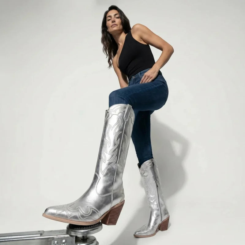 Model wearing Yehaw silver vegan microfibre mid-calf cowgirl boots with pointed toes and high heels.