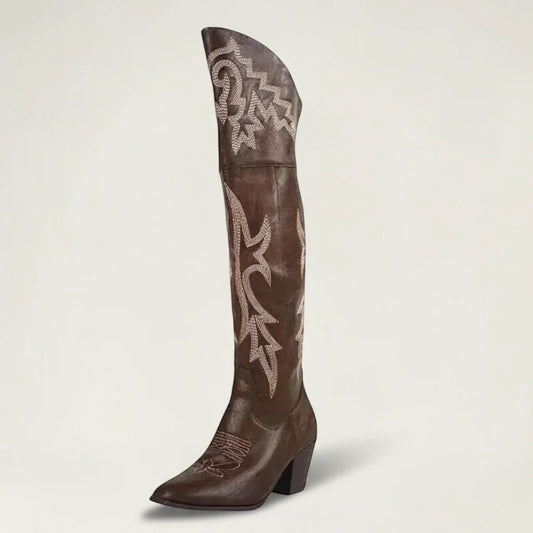 Yehaw brown vegan leather knee-high cowgirl boots with white western embroidery and a pointed toe.