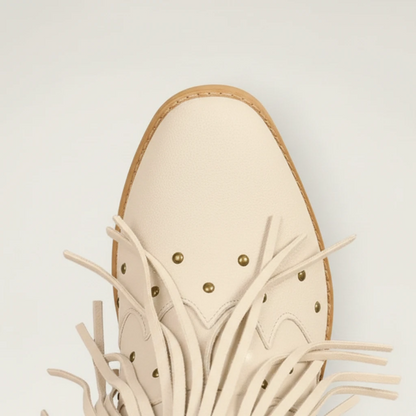 Yehaw beige vegan leather mid-calf cowgirl boots with fringe detailing, round toe, and side zip closure.