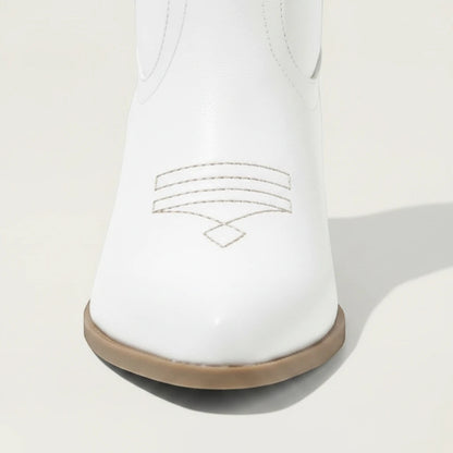 Yehaw white vegan leather ankle-height cowgirl boots with pointed toe and high heel.