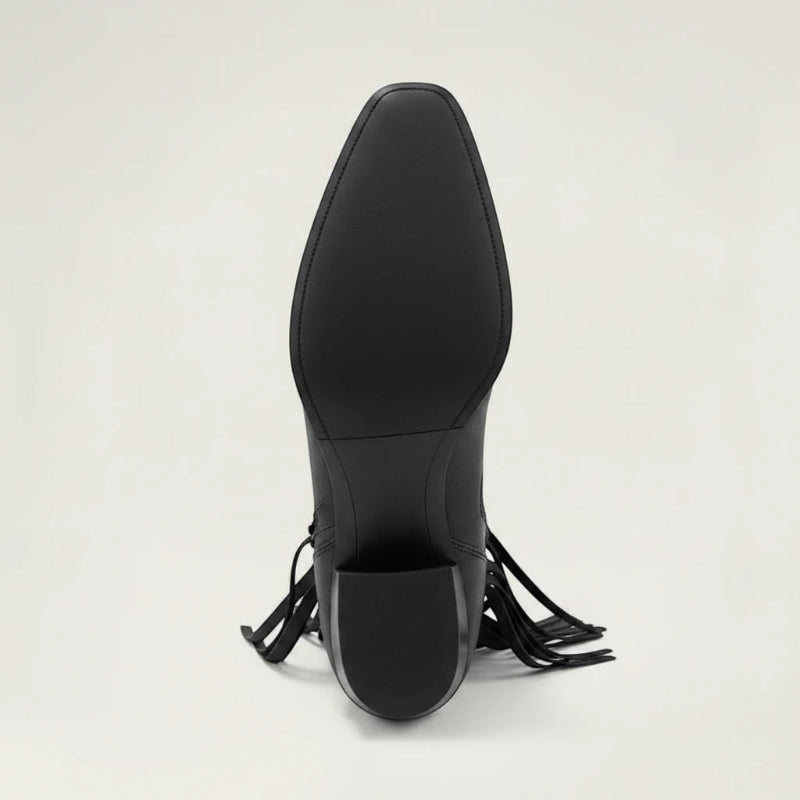 Yehaw DALIA black vegan leather ankle cowgirl boots with fringe detailing and a pointed toe on a neutral background.