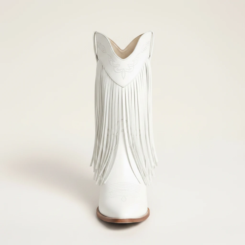 Yehaw Alejandra white vegan leather mid-calf cowgirl boots with fringe detail and pointed toe worn with blue jeans