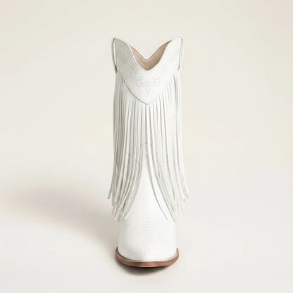 Yehaw Alejandra white vegan leather mid-calf cowgirl boots with fringe detail and pointed toe worn with blue jeans
