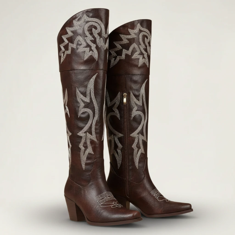 Yehaw brown vegan leather knee-high cowgirl boots with white western embroidery and a pointed toe.