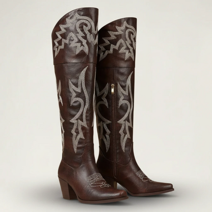 Yehaw brown vegan leather knee-high cowgirl boots with white western embroidery and a pointed toe.