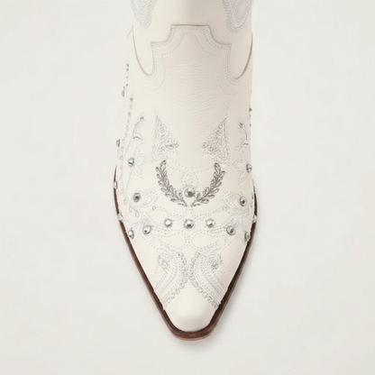 Yehaw beige vegan leather mid-calf cowgirl boots with intricate silver embroidery, side zip, and a pointed toe.