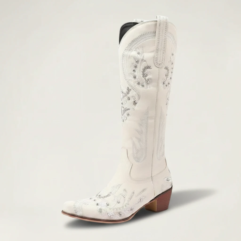 Yehaw beige vegan leather mid-calf cowgirl boots with intricate silver embroidery, side zip, and a pointed toe.