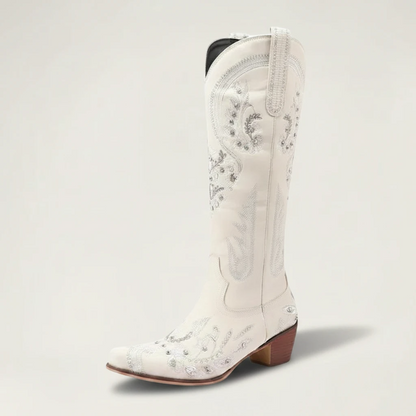 Yehaw beige vegan leather mid-calf cowgirl boots with intricate silver embroidery, side zip, and a pointed toe.