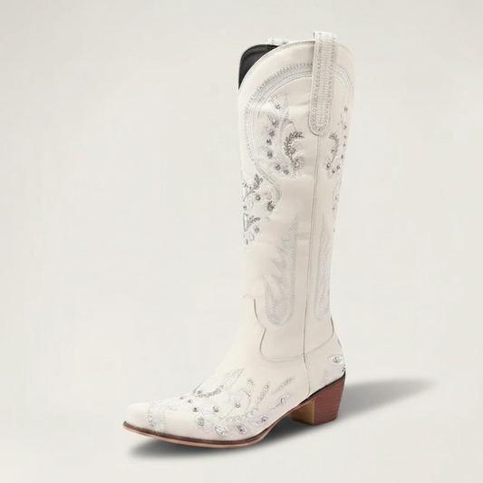 Yehaw beige vegan leather mid-calf cowgirl boots with intricate silver embroidery, side zip, and a pointed toe.