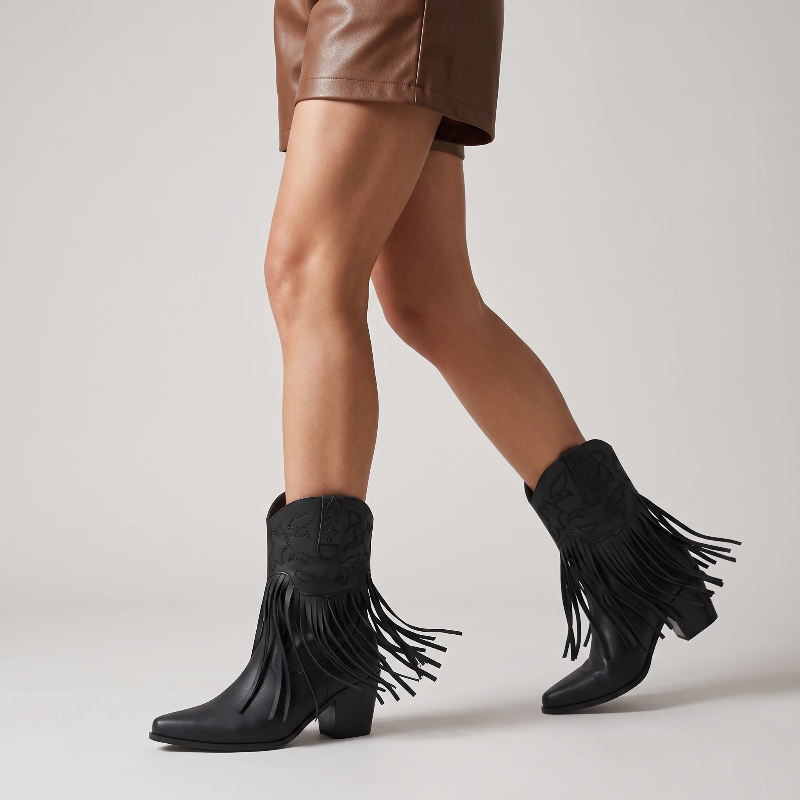 Yehaw DALIA black vegan leather ankle cowgirl boots with fringe detailing and a pointed toe on a neutral background.