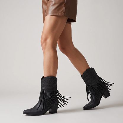 Yehaw DALIA black vegan leather ankle cowgirl boots with fringe detailing and a pointed toe on a neutral background.