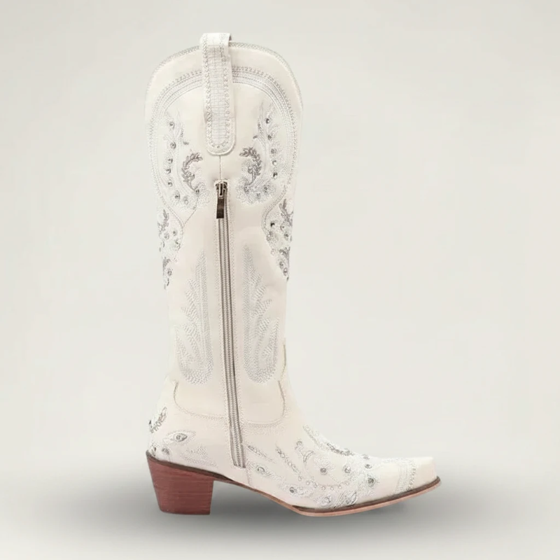 Yehaw beige vegan leather mid-calf cowgirl boots with intricate silver embroidery, side zip, and a pointed toe.