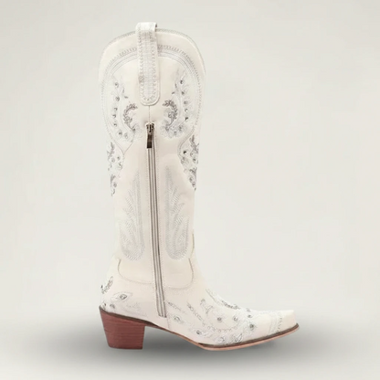 Yehaw beige vegan leather mid-calf cowgirl boots with intricate silver embroidery, side zip, and a pointed toe.