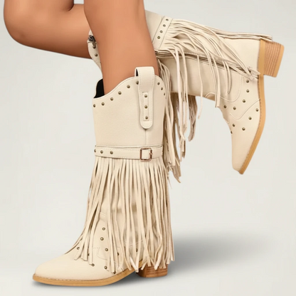 Yehaw beige vegan leather mid-calf cowgirl boots with fringe detailing, round toe, and side zip closure.