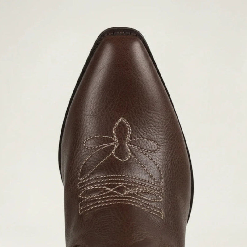 Yehaw brown vegan leather knee-high cowgirl boots with white western embroidery and a pointed toe.