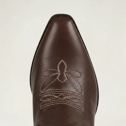 Yehaw brown vegan leather knee-high cowgirl boots with white western embroidery and a pointed toe.