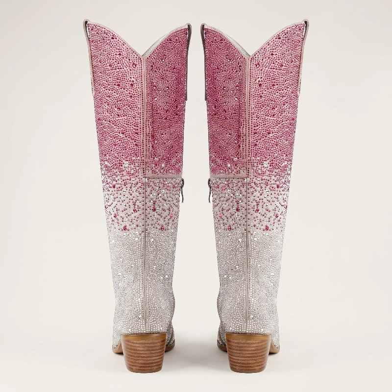 Yehaw knee-high vegan leather cowgirl boots with pink and silver rhinestones and a pointed toe.