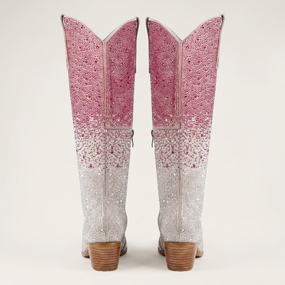 Yehaw knee-high vegan leather cowgirl boots with pink and silver rhinestones and a pointed toe.