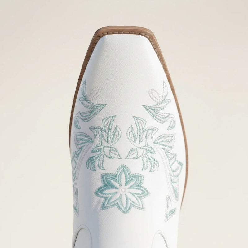 Yehaw ADRIANA white vegan suede mid-calf cowgirl boots with light blue floral embroidery and a medium block heel.