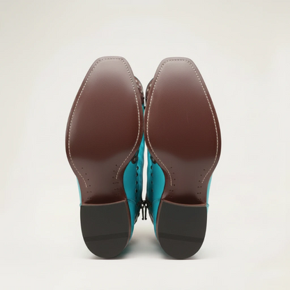 Yehaw ADELE knee-high turquoise vegan leather cowgirl boots with brown trim, silver studs, and decorative fringe