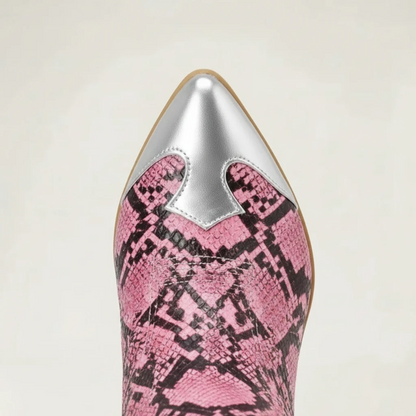 Yehaw Clementine knee-high cowgirl boots in pink snakeskin vegan leather with silver metallic accents and pointed toe.