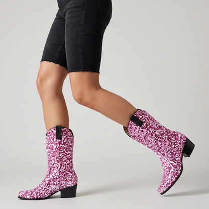 Yehaw pink mid-calf cowgirl boots featuring vegan glitter sequin detailing, a pointed toe, and a medium block heel.