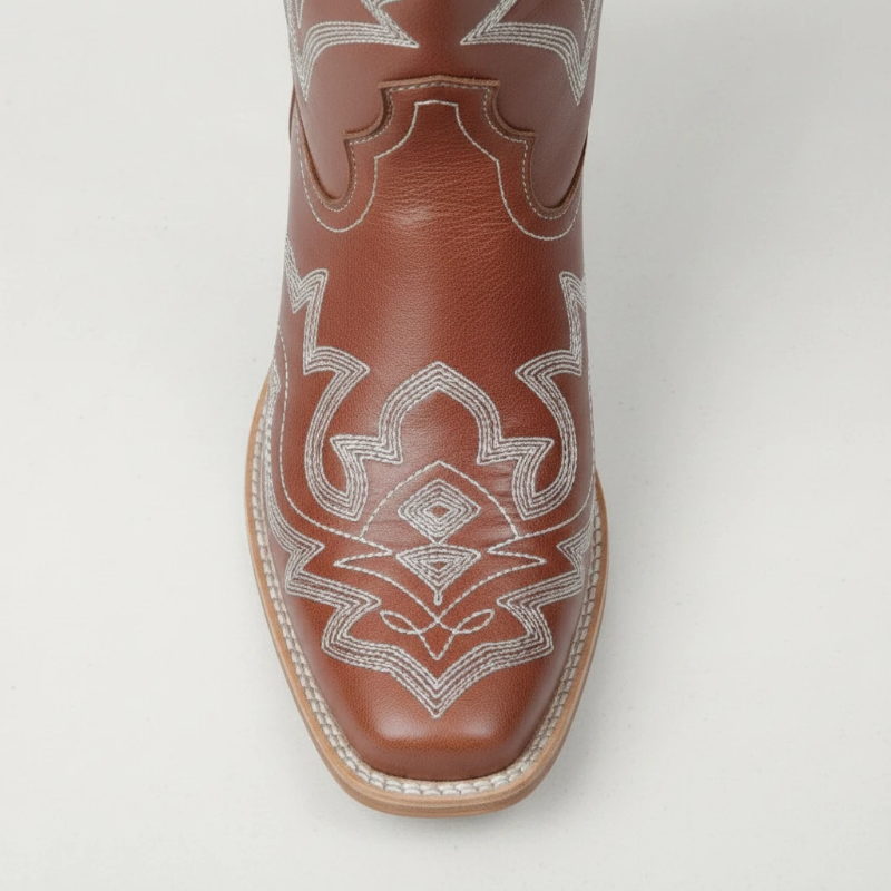 Yehaw brown vegan leather mid-calf cowgirl boots with white western embroidery and a round toe design.