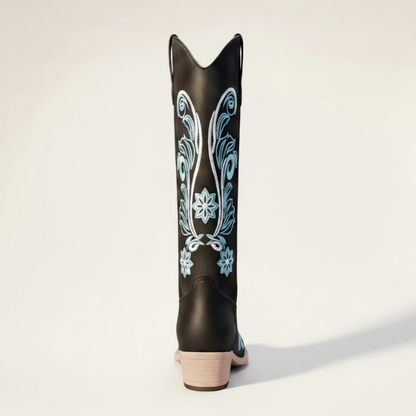 Yehaw Adriana black vegan suede mid-calf cowgirl boots with intricate light blue floral embroidery and a round toe.