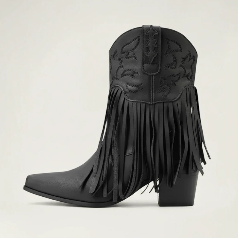 Yehaw DALIA black vegan leather ankle cowgirl boots with fringe detailing and a pointed toe on a neutral background.
