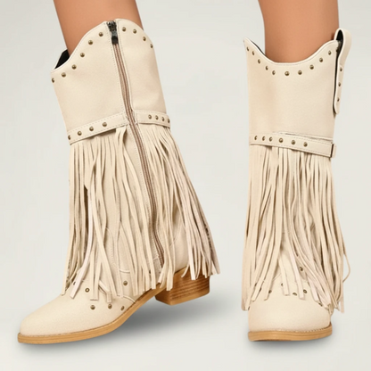 Yehaw beige vegan leather mid-calf cowgirl boots with fringe detailing, round toe, and side zip closure.
