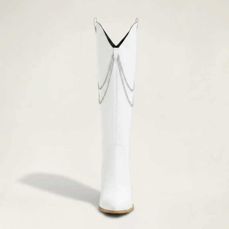 Yehaw white knee-high vegan suede cowgirl boots with pointed toe, block heel, and decorative silver chain detail