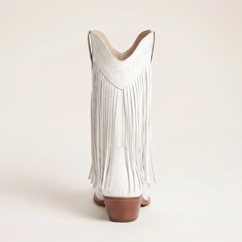 Yehaw Alejandra white vegan leather mid-calf cowgirl boots with fringe detail and pointed toe worn with blue jeans
