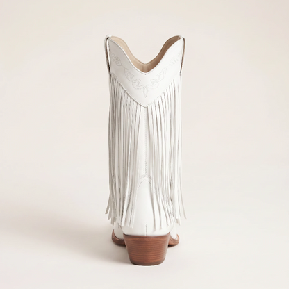 Yehaw Alejandra white vegan leather mid-calf cowgirl boots with fringe detail and pointed toe worn with blue jeans