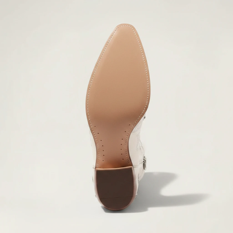 Yehaw beige vegan leather mid-calf cowgirl boots with intricate silver embroidery, side zip, and a pointed toe.