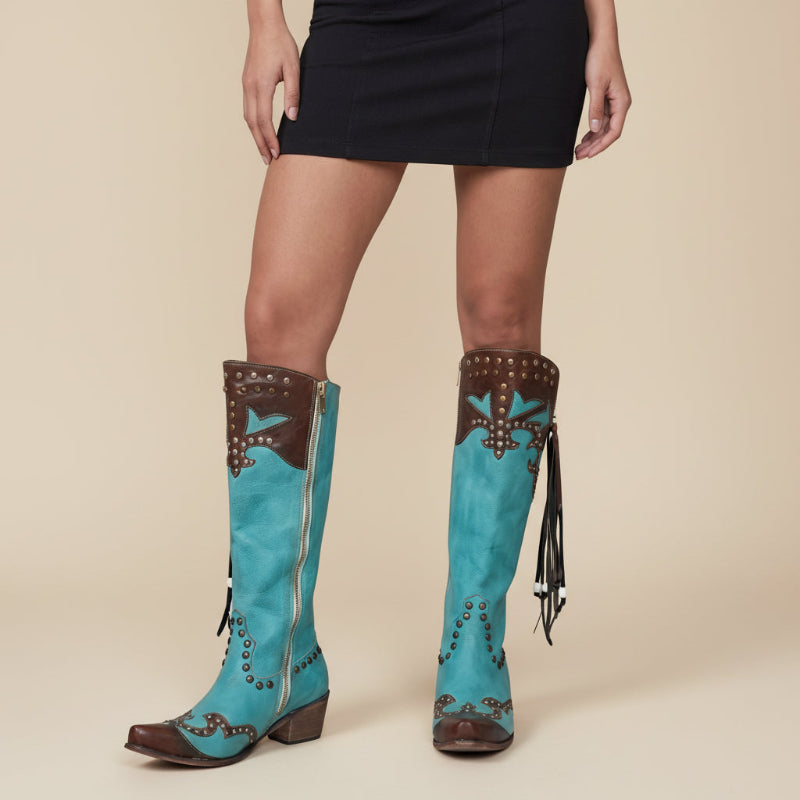 Yehaw ADELE knee-high turquoise vegan leather cowgirl boots with brown trim, silver studs, and decorative fringe