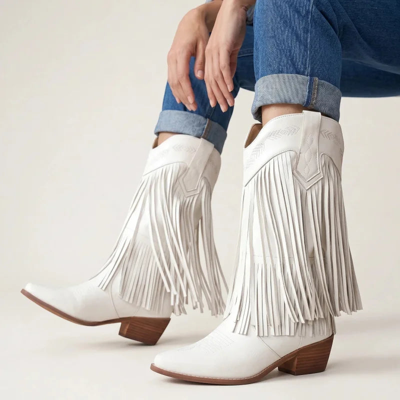 Yehaw Alejandra white vegan leather mid-calf cowgirl boots with fringe detail and pointed toe worn with blue jeans
