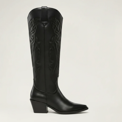 Yehaw black vegan leather knee-high cowboy boots with pointed toe and medium heel. Features intricate western-style embroidery.