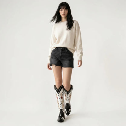Model wearing Yehaw AMANDA black and white vegan leather mid-calf cowgirl boots with star and lightning bolt details.