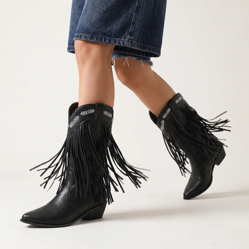 Yehaw black vegan leather mid-calf cowgirl boots with fringe detailing and white embroidered western patterns.