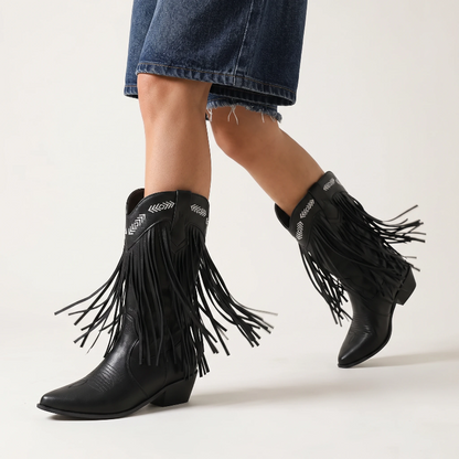 Yehaw black vegan leather mid-calf cowgirl boots with fringe detailing and white embroidered western patterns.
